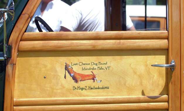 The driver's door on a 1939 Ford Deluxe Woody Wagon on display during the