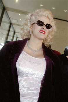 Smith wore a pale pink top with the word ''Spoiled'' beaded on it to court in 2001. Photo: Carlos Antonio Rios, Chronicle