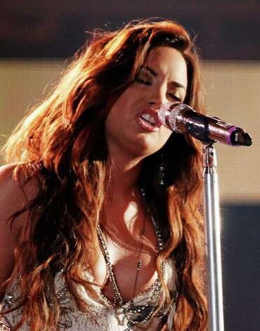 HOLLYWOOD CA AUGUST 14 Actress singer Demi Lovato performs onstage 