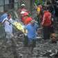 Rescue workers carry the body of a typhoon victim from an area of.... photo: 1630328 slideshow 31095