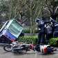 Motorcyclists hold on to a tree in strong winds as typhoon Nesat.... photo: 1634856 slideshow 31095