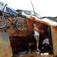 A couple repairs their shanty destroyed during the height of.... photo: 1639832 slideshow 31095