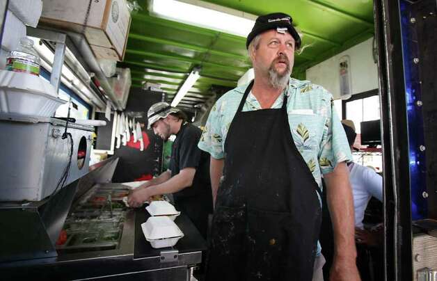 Ralph Gilmore owner of Turf and Surf PoBoys food trailer serves tacos and