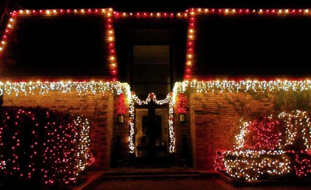 Christmas Lights professionally install lights on a home in Orange ...