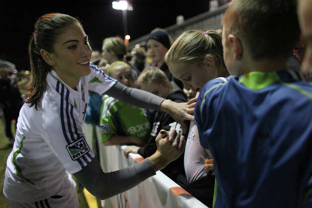 Seattle Sounders player Hope Solo signs autographs during the Sounders women