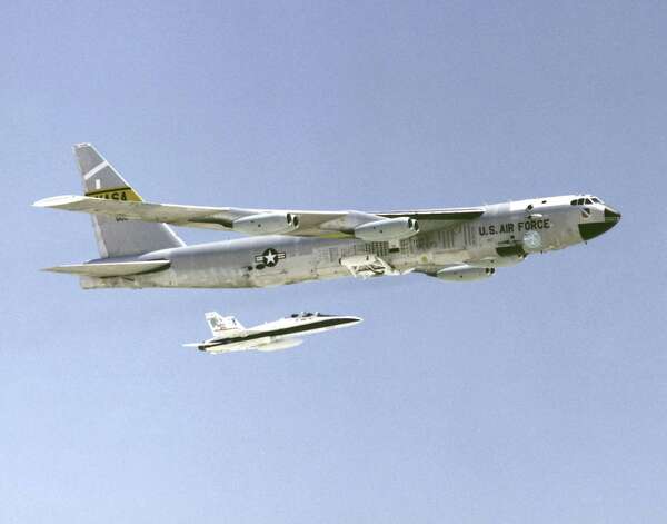A B-52 bomber is accompanied by an F/A-18 fighter in this undated photo. Photo: Getty Images / Getty Images North America