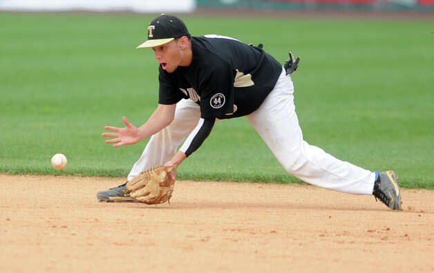 Trumbull's Brandon Liscinsky fields a ground ball during the FCIAC baseball semifinal against Staples High School Thursday, May 24, 2012 at the Ballpark at Harbor Yard in Bridgeport, Conn. Photo: Autumn Driscoll / Connecticut Post