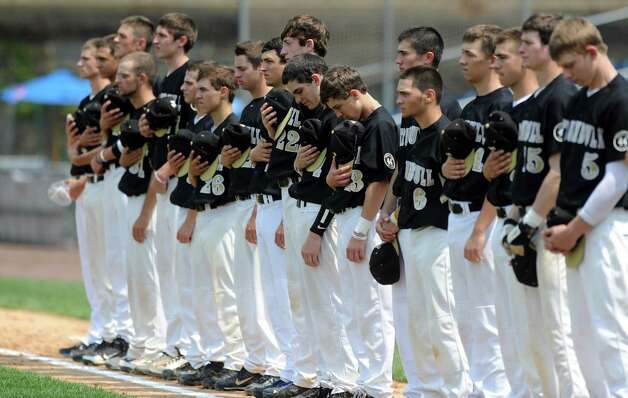 Trumbull players stand for the national anthem during Saturday's FCIAC baseball championship game at the Ballpark at Harbor Yard in Bridgeport on May 26, 2012. Photo: Lindsay Niegelberg / Stamford Advocate