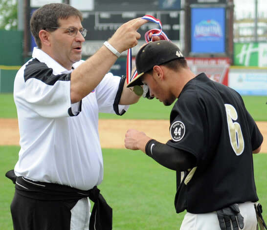 Trumbull's Brandon Liscinsky gets a medal after his team beat Greenwich in Saturday's FCIAC baseball championship game at the Ballpark at Harbor Yard in Bridgeport on May 26, 2012. Photo: Lindsay Niegelberg / Stamford Advocate