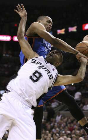 San Antonio Spurs' Tony Parker (9) is fouled by Oklahoma City Thunder's Russell Westbrook (0) during the first half of game two of the NBA Western Conference Finals in San Antonio, Texas on Tuesday, May 29, 2012. Edward A. Ornelas/Express-News (Edward A. Ornelas / San Antonio Express-News) / SA