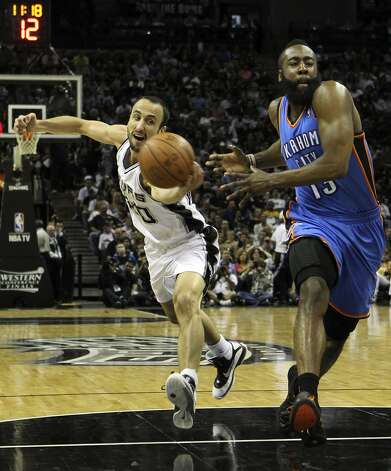 San Antonio Spurs' Manu Ginobili (20) swipes the ball away from Oklahoma City Thunder's James Harden (13) during the first half of game two of the NBA Western Conference Finals in San Antonio, Texas on Tuesday, May 29, 2012. Kin Man Hui/Express-News (Kin Man Hui / San Antonio Express-News) / SA