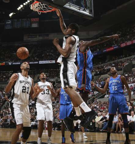 San Antonio Spurs' Kawhi Leonard (2) dunks over Oklahoma City Thunder's Kendrick Perkins (5) during the first half of game two of the NBA Western Conference Finals in San Antonio, Texas on Tuesday, May 29, 2012. Edward A. Ornelas/Express-News (Edward A. Ornelas / San Antonio Express-News) / SA