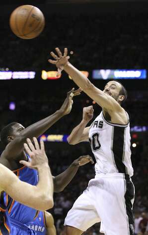 San Antonio Spurs' Manu Ginobili (20) passes over Oklahoma City Thunder's Nazr Mohammed (8) during the first half of game two of the NBA Western Conference Finals in San Antonio, Texas on Tuesday, May 29, 2012. Edward A. Ornelas/Express-News (Edward A. Ornelas / San Antonio Express-News) / SA