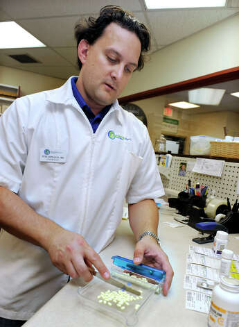 Peter D'Aprile, RPh, MBA, is the owner and pharmacist of English Apothecary in Bethel. Photo: Carol Kaliff / CT