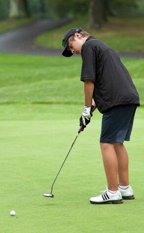 Playing in the boys 14 to 17 year old division Owen Tedford putts on the 18th green in the Greenwich Townwide Jr. golf championships held at Griffith E. Harris golf course, Greenwich, CT on Wednesdy August 15th, 2012. Photo: Mark Conrad / Stamford Advocate Freelance