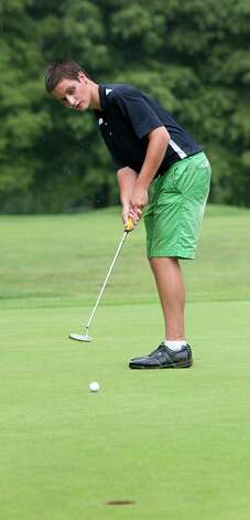 Playing in the boys 14 to 17 year old division Nick Marchak putts on the 18th green in the Greenwich Townwide Jr. golf championships held at Griffith E. Harris golf course, Greenwich, CT on Wednesdy August 15th, 2012. Photo: Mark Conrad / Stamford Advocate Freelance