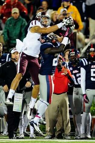 OXFORD, MS - OCTOBER 06:  Mike Evans #13 of the Texas A&M Aggies catches a pass over Senquez Golson #21 of the Ole Miss Rebels during a game at Vaught-Hemingway Stadium on October 6, 2012 in Oxford, Mississippi.  (Photo by Stacy Revere/Getty Images) (Getty Images) / SA
