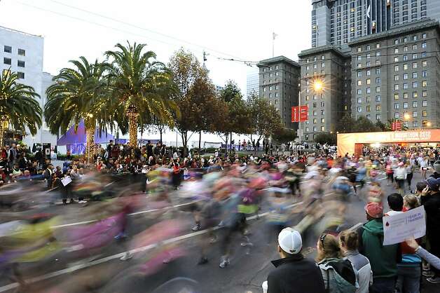Runners blur past Union Square for the start of the 2012 Nike WomenÕs Marathon &amp; Half Marathon in San Francisco, CA on Sunday, October 14th, 2012 Photo: Michael Short, Special To The Chronicle / SF