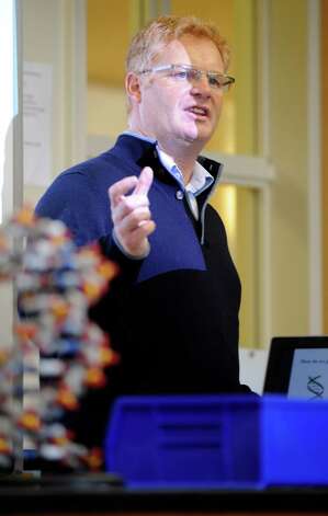 Dr. Bruce Nash, of the Cold Spring Harbor Laboratory, speaks with Upper School classes to discuss gene therapy at Convent of the Sacred Heart on Monday, October 15, 2012. Convent of the Sacred Heart is the third school, and the first Connecticut-based school, to become a charter member of the Cold Spring Harbor genetics lab. Photo: Helen Neafsey / Greenwich Time