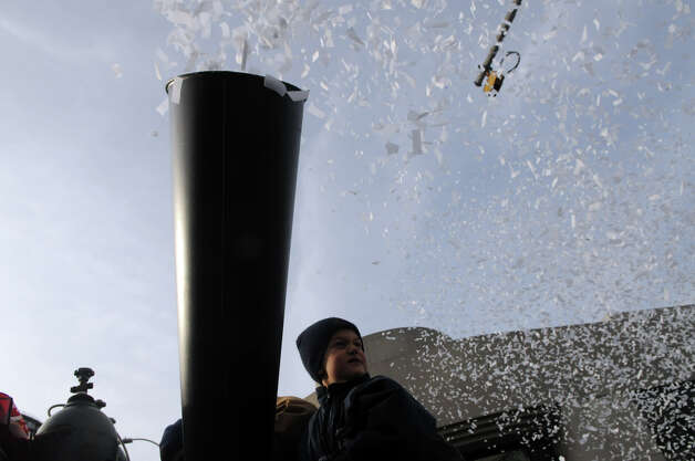 Ethan Effren fires confetti from a Turn of River truck at the end of the UBS Parade Spectacular in Stamford, Conn., Nov. 18, 2012. Photo: Keelin Daly / Stamford Advocate Freelance