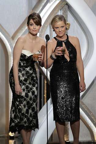 BEVERLY HILLS, CA - JANUARY 13: In this handout photo provided by NBCUniversal, L to R Tina Fey and Amy Poehler host the 70th Annual Golden Globe Awards at the Beverly Hilton Hotel International Ballroom on January 13, 2013 in Beverly Hills, California. (Photo by Paul Drinkwater/NBCUniversal via Getty Images) Photo: Handout, Getty Images