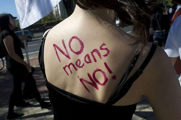 A woman marches in an event in Cape Town in 2011 demanding an end to violence against women. Photo: Str, AFP/Getty Images