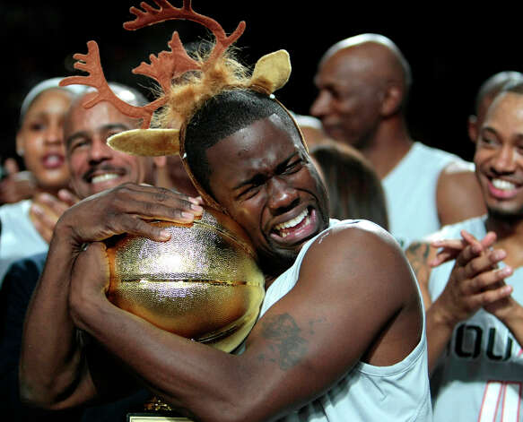 After being named MVP of the Celebrity game comedian Kevin Hart hugs the MVP trophy during the 2013 Sprint All-Star Celebrity game. Photo: Billy Smith II, Houston Chronicle / © 2013 Houston Chronicle