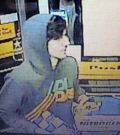 This surveillance photo released via Twitter Friday, April 19, 2013 by the Boston Police Department shows a suspect entering a convenience store that police are pursuing in Watertown, Mass.  Police say he is one of two suspects in the fatal shooting of an MIT police officer and tied to the Boston Marathon bombing. Photo: Boston Police Department