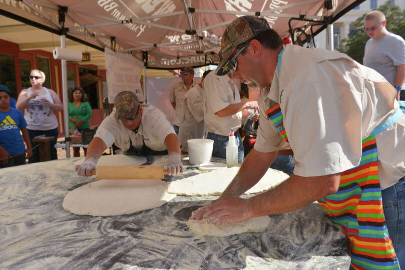 Alex Rymers and Warren Haby of Dirt Road Cookers roll out dough during an attempt to snag the Gui