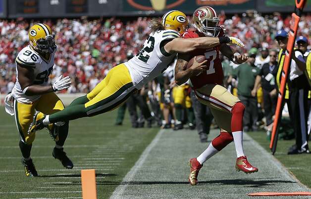 Clay Matthews dives at Colin Kaepernick in the second quarter