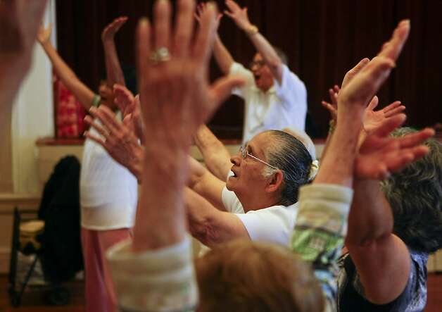 Amanda Arteaga takes part in warm-up vocal exercises with the Community of Voices choir at Mission Neighborhood Center. Photo: Raphael Kluzniok, The Chronicle