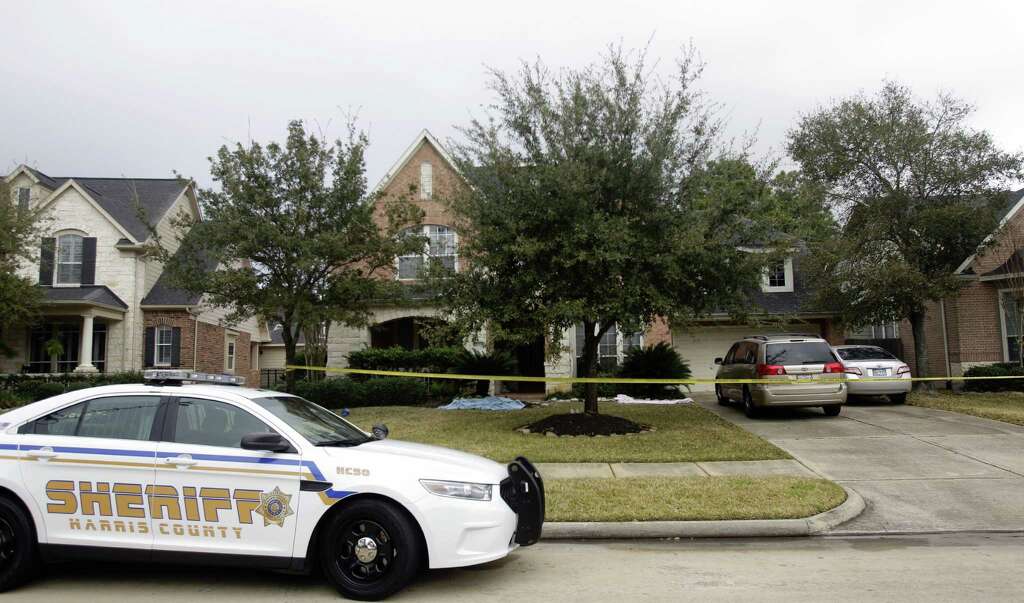 A Harris County Sheriff patrol car is shown at a home at 14015 Fosters Creek Dr. Friday, Jan. 31, 2014 in Cypress where four people where found dead inside on Thursday. Photo: Melissa Phillip