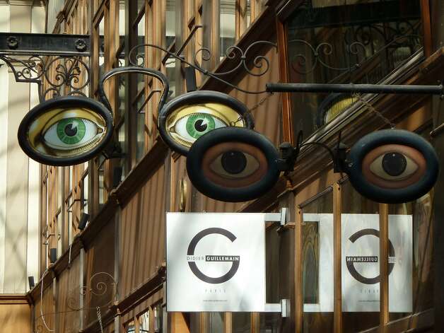 Expressive signs mark an eyeware boutique in Passage du Grand Cerf in Paris.Expressive signs marking an eye ware boutique in Passage du Grand Cerf. Photo: Ann Head Hilton, Special To The Chronicle