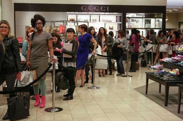 People wait in line as actress Sarah Jessica Parker meets fans at the Seattle Nordstrom store.