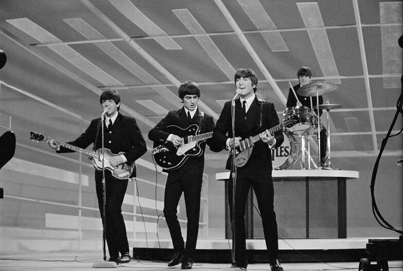NEW YORK - FEBRUARY 9: The Beatles perform during their first appearance on THE ED SULLIVAN SHOW, February 9, 1964.  Paul McCartney, George Harrison, John Lennon and Ringo Starr are shown.  (Photo by CBS via Getty Images) *** Local Caption *** Paul McCartney;George Harrison;Ringo Starr;John Lennon