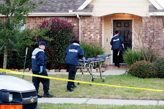 Authorities investigate the shooting of a teen at a home in the 22300 block of Bridgestone Ridge, Thursday, March 13, 2014, in Houston. The shooing happened about 2:30 a.m. on Bridgestone Ridge near FM 2920 after a man found a a 17-year-old male in his daughter's bedroom. There was a struggle and the teen was shot. Photo: Cody Duty, Houston Chronicle / © 2014 Houston Chronicle