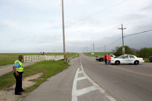 Emergency personnel block the road to the Texas City Dike following a barge collision in the ship channel, causing an oil spill Saturday, March 22, 2014, in Houston. Photo: Brett Coomer, Houston Chronicle / © 2014 Houston Chronicle