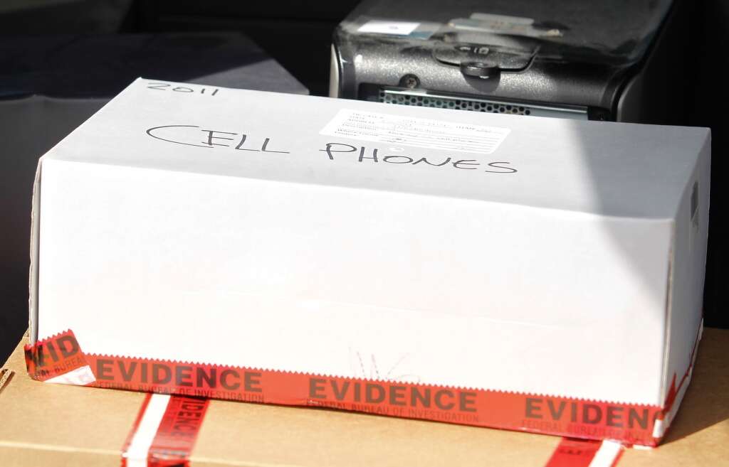 A box of cell phones sit in a van collected as evidence by the FBI from the house of state Sen. Leland Yee (D-San Francisco) in San Francisco on Wednesday, March 26, 2014. Yee has been arraigned in federal court on charges of public corruption. Photo: Mathew Sumner, Special To The Chronicle