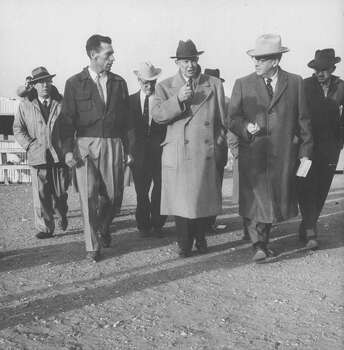Ezra T. Benson (2R) walking with Pres. Dwight D. Eisenhower (C) during tour of the southwest.  (Photo by Paul Schutzer//Time Life Pictures/Getty Images) Photo: Paul Schutzer, Time & Life Pictures/Getty Image / Time Life Pictures