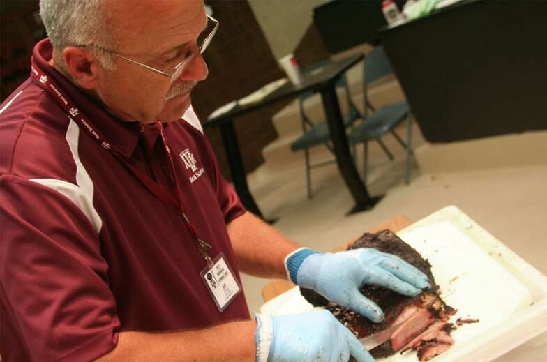 Jeffrey Savell, a professor in the Department of Animal Science at Texas A&M University, teaches a class in barbecue