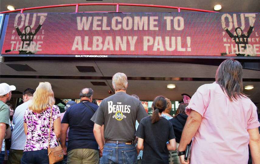 Fans queue up for official tour merchandise at the Times Union Center before the Paul McCartney Out 