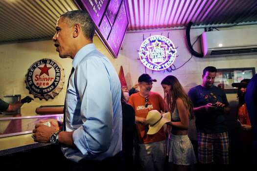 President Barack Obama orders barbecue at Franklin Barbecue in Austin, Texas, Thursday, July 10, 2014. Austin is the final leg in his three city trip before returning to Washington. (AP Photo/Jacquelyn Martin) Photo: Jacquelyn Martin, Associated Press / AP