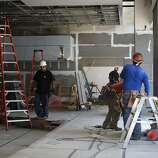 Construction takes place in the meat section and taco bar of the new locally owned grocery store named Market on Market on the first floor of the Twitter building  in San Francisco, Calif., on Thursday, October 23, 2014.
