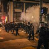 Cops break up the crowds in the in the streets of San Francisco after the Giants won the wold series on October 29th 2014.