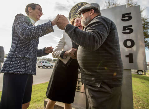 Sarah Goodfriend, left, and Suzanne Bryant hold hands with Rabbi Kerry Baker during their wedding ceremony outside of the Travis County Clerk's office in Austin, Texas on Thursday morning, Feb. 19, 2015.  Travis County spokeswoman Ginny Ballard said the marriage occurred Thursday, though it wasn't immediately clear if the license has legal standing. The marriage followed a state District Court order instructing that officials not rely on Texas' unconstitutional prohibitions on same-sex marriage. (AP Photo/Austin American-Statesman, Ricardo B. Brazziell)  Photo: RICARDO B. BRAZZIELL, Associated Press / Austin American-Statesman