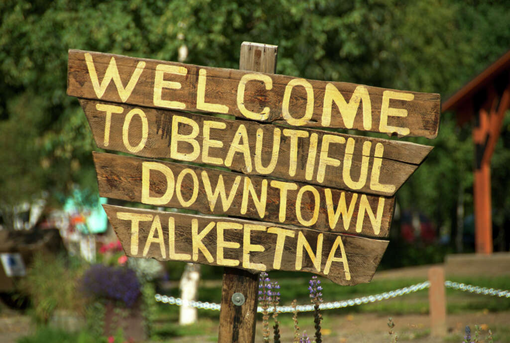Above: A homespun sign welcomes visitors to the offbeat town of Talkeetna, the model for the 1990s show “Northern Exposure.” Photo: John Flinn / Special To The Chronicle / ONLINE_CHECK