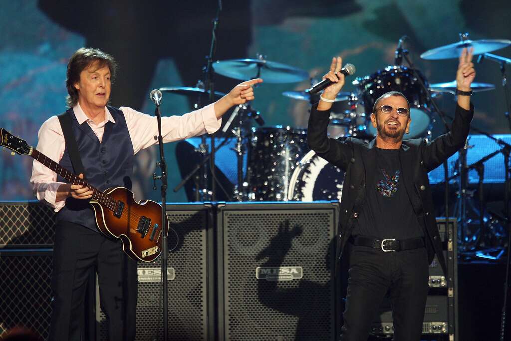 FILE - In this Jan. 27, 2014 file photo, Paul McCartney, left, and Ringo Starr perform at The Night that Changed America: A Grammy Salute to the Beatles in Los Angeles. McCartney will induct his former Beatle mate, Ringo Starr, into the Rock and Roll Hall of Fame next month. The 30th annual induction ceremony is scheduled for Cleveland's Public Hall on April 18. (Photo by Zach Cordner/Invision/AP, File) Photo: Zach Cordner, Associated Press