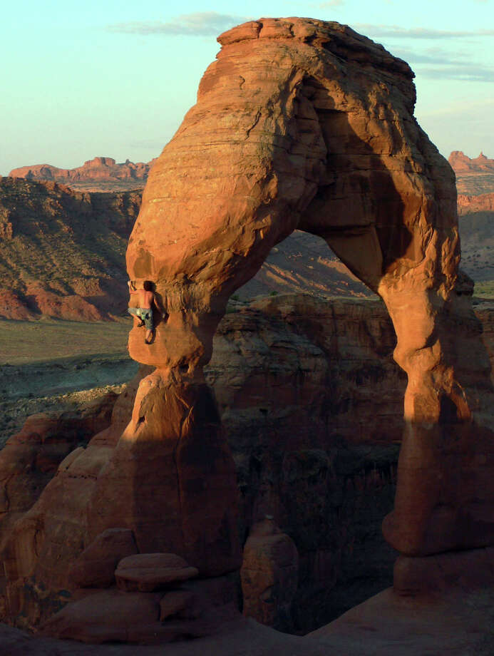 Famed rock climber Dean Potter makes his way up Delicate Arch in Arches National Park in Utah in 2006. Photo: Anonymous / ASSOCIATED PRESS / DEAN POTTER