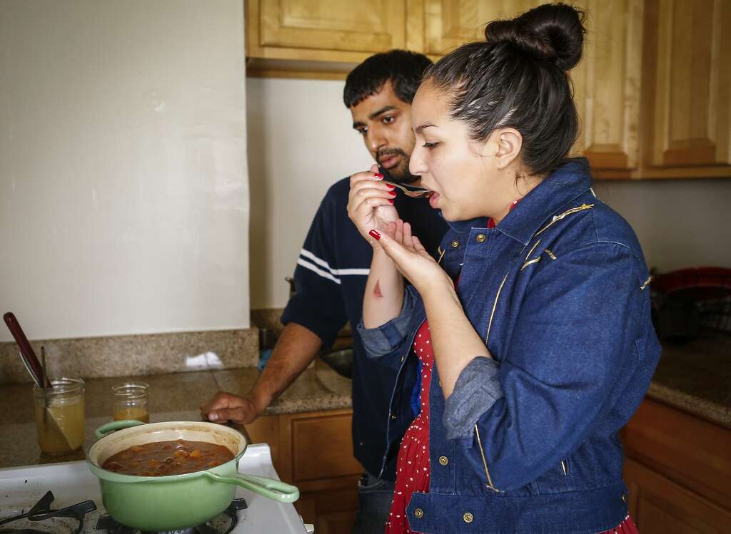 Stephany Gocobachi and Akhil Khadse of Flour Child taste test a batch of Peach Jam. Photo: Russell Yip, The Chronicle