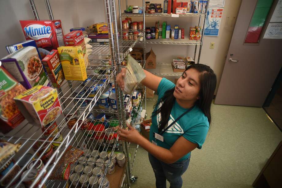 Vivian Duran, 23, of Houston and a Chemical Engineering major at Lone Star College - Montgomery who plans to finish her degree at Lamar University, volunteers at the school's food pantry between classes on Oct. 16, 2015. The food pantry is the system's first and is an official partner agency with the Montgomery County Food Bank. (Photo by Jerry Baker/Freelance)4 Photo: Jerry Baker, Freelance